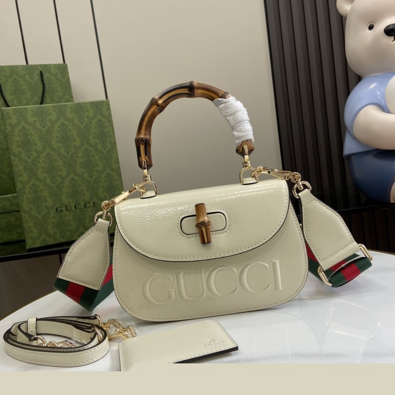 G*u*i top handle bags